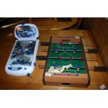 A small table top Soccer game and a Star Wars battery operated pinball machine.