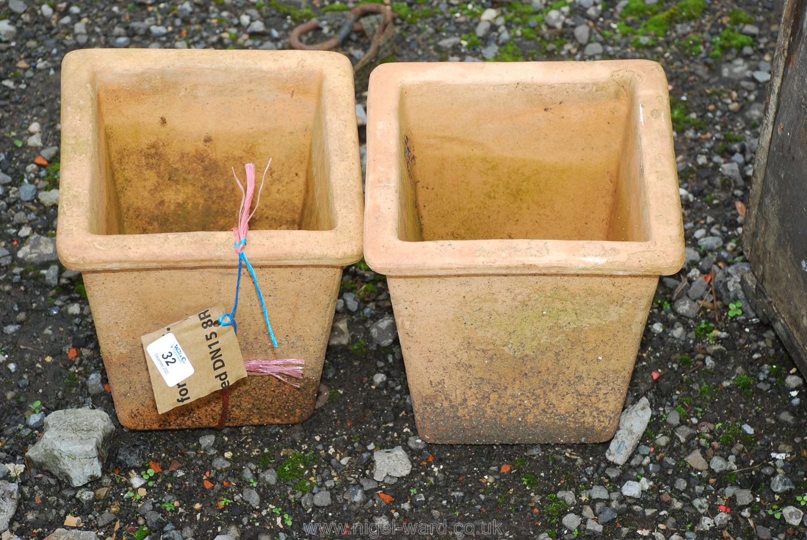 Two small terracotta square planters.