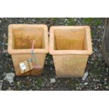 Two small terracotta square planters.