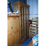 A tall, small-pane glazed display cupboard, 91'' high x 38'' x 15'' deep.