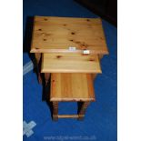 A nest of three Pine occasional Tables.