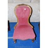 A Victorian Satinwood show-framed button-back lady's boudoir chair standing on scroll front legs