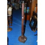 A reeded column Mahogany standard lamp on a base with carved paw feet.