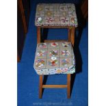 Two nicely worked tapestry-upholstered wooden-framed stools.