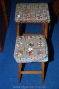 Two nicely worked tapestry-upholstered wooden-framed stools.