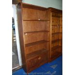 A floor-standing hardwood three-shelf display shelf unit with two door under-cupboard,