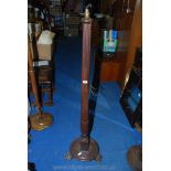 A reeded column Mahogany standard lamp on claw-footed base.