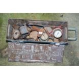 A metal box with various old brass gauges, a blow lamp, bolt cutters, a shoe last, etc.
