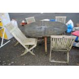 A Wooden patio table and five chairs.