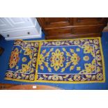 Two colourful Readicut Rugs, 70'' x 35''.