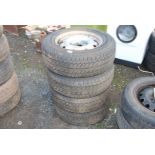 Four 205/65 R15C 102/100T tyres on rims.