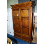 A hardwood two door wardrobe with two lower drawers, 80'' high x 46'' wide x 25'' deep.