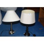 Two modern table lamps and cream/white shades.