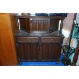 A reproduction dark Oak Court Cupboard by Elliott's of Newbury with original paperwork and a letter