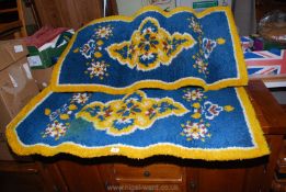 Two colourful "Readicut" rugs 52'' x 26''.