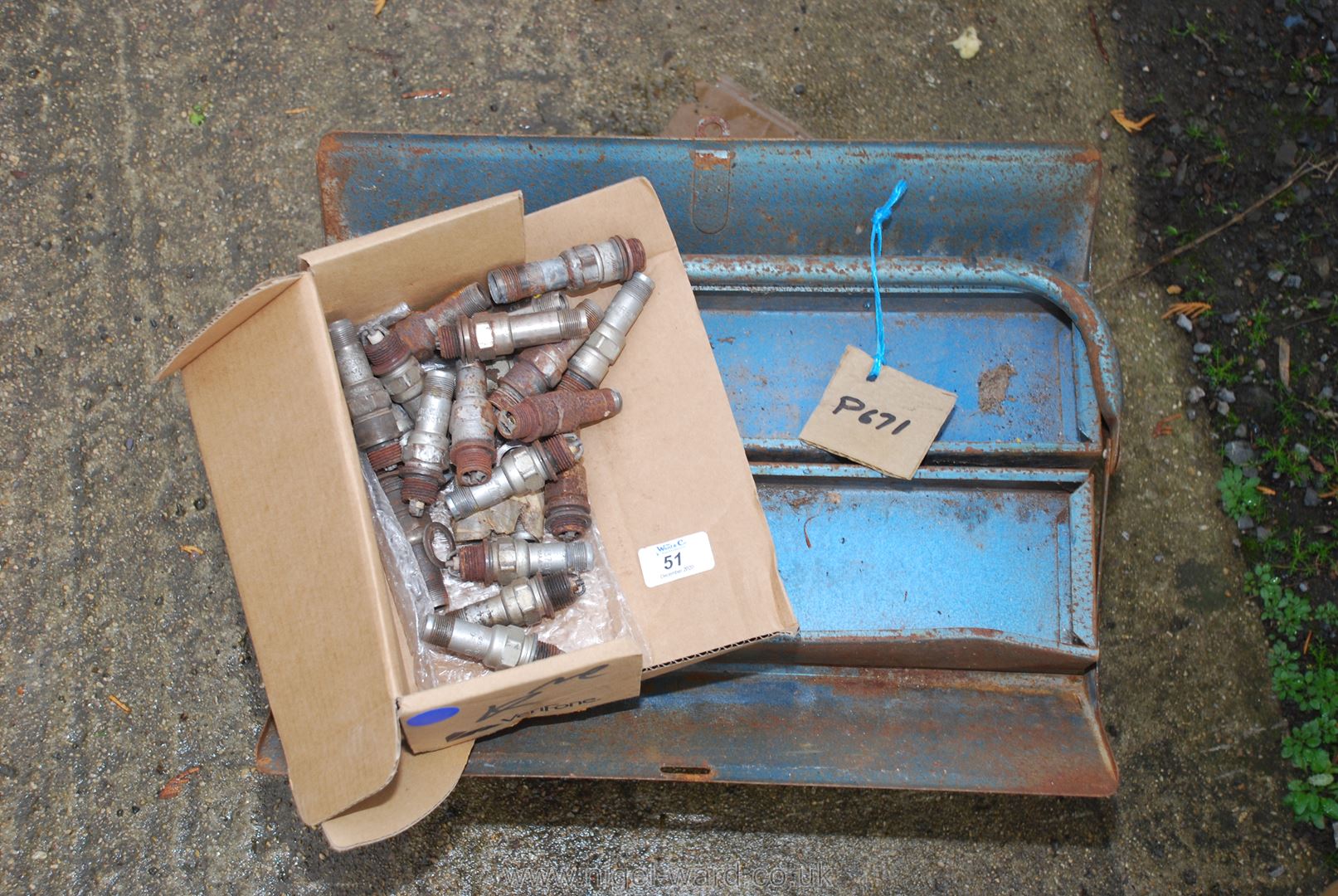 A Metal toolbox and spark plugs, possibly waterproof/ex-military vehicle.