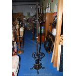 A metal hat and coat stand with an umbrella/stick stand base.