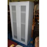 A contemporary Perspex panelled doored Cupboard with shelved interior.