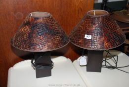 A pair of modernist square-based table lamps and shades.