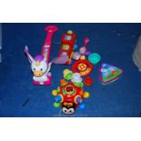 A collection of children's toys including Fisher-Price Push and Flutter Unicorn,