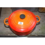 An orange Le Creuset casserole dish.