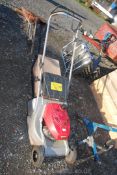 A Honda HR173 petrol rotary mower with self drive.