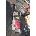 A Honda HR173 petrol rotary mower with self drive.