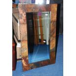 An attractive and very heavy contemporary rectangular framed bevelled wall-hanging mirror.