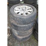 Four 195/R55 R15 tyres on metal rims.