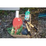 A crate including wire baskets, paint,