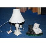 A "Black & White Whisky" advertising type dog ornament and a table lamp with a cream/ white shade.