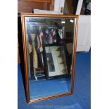 A framed bevel plated wall-hanging mirror. 45'' x 27''.