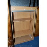 A tambour fronted Office Cabinet, 63'' high x 40'' wide x 22'' deep.