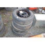Four 165/65 R1377T tyres.
