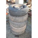 Five 195/65 R15 tyres on rims.