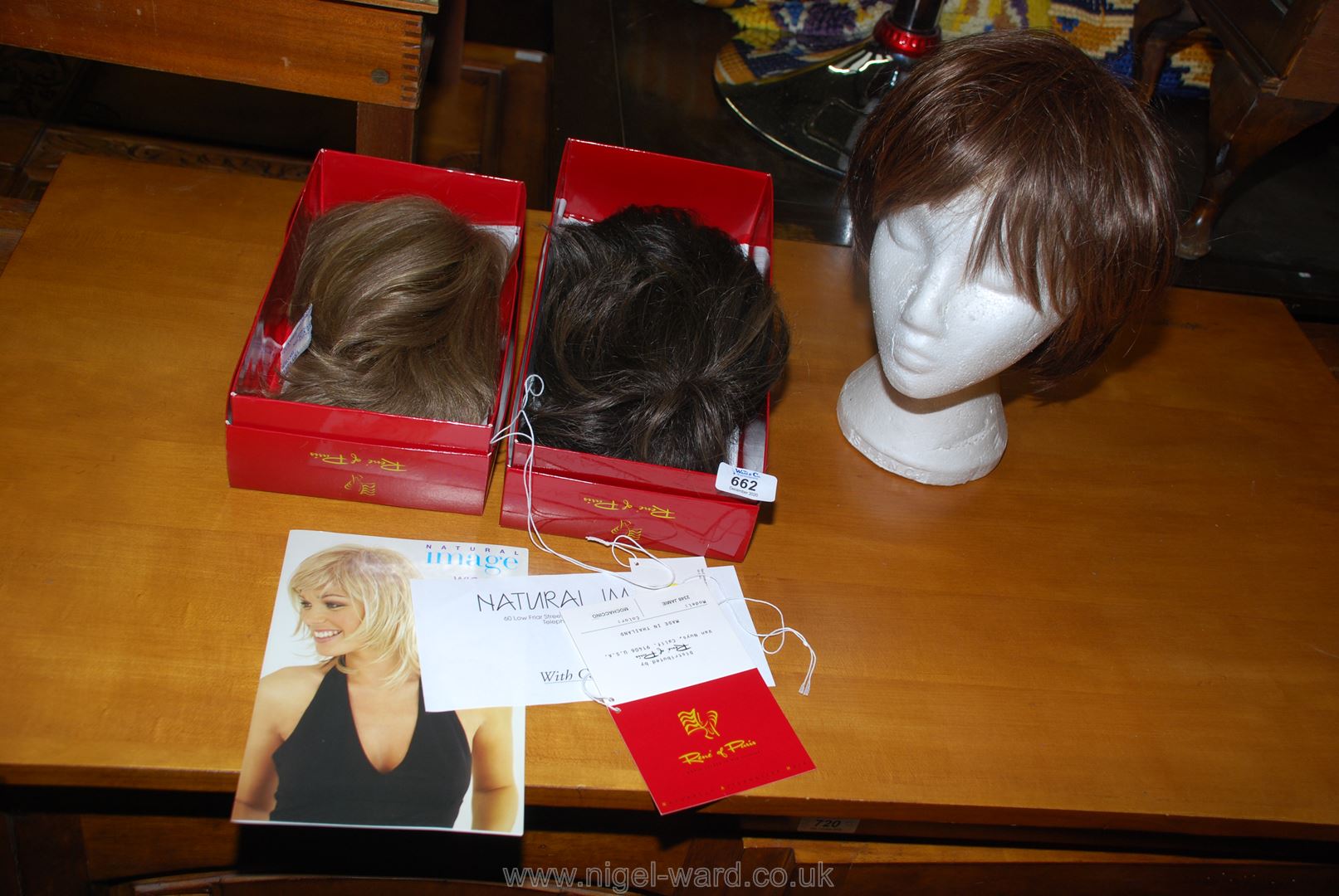 Three lady's wigs.