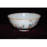 A Qianlong period famille rose Punch Bowl, mid 18th c, old riveted repairs and hairline cracks,