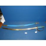 An Indian decorative metal Sword with blue handle and sheath.