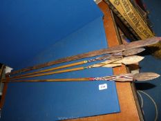 Three decorative wooden Spears with colourful threading and bow,