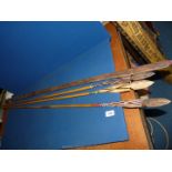 Three decorative wooden Spears with colourful threading and bow,