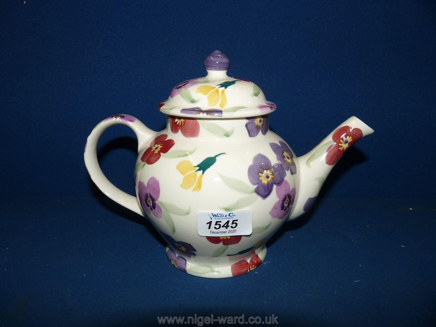 A pristine Emma Bridgewater teapot in wallflower pattern.