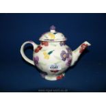A pristine Emma Bridgewater teapot in wallflower pattern.