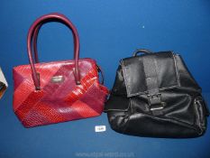 A red David Jones, Paris ladies handbag and a Prada, Italy back pack.
