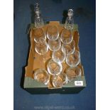 A set of twelve wine glasses plus two glass dressing table bottles