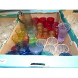 A quantity of coloured glass, smoky glass water set (five glasses), cranberry tumblers,