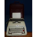 A cased Scheidegger President typewriter.