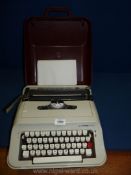 A cased Scheidegger President typewriter.