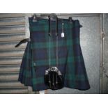 A "Kilt Society" kilt in navy, blue and green tartan,