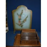 A wooden tray, letter rack, book rest and a wooden fire screen decorated with flowers painted green.