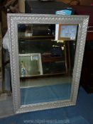 A bevelled edge Mirror made by Gallery with silver coloured lattice frame,